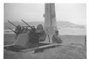 A photograph taken by Olin Dows of an anti-aircraft gun on Plymouth Hoe
