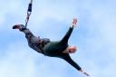 Liberal Democrat leader Sir Ed Davey taking part in a bungee jump during a visit to Eastbourne Borough Football Club in East Sussex.