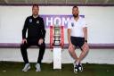 Jamie Smith, Joint First Team Manager (left), and Al Parsons, Commercial Manager (right), in the dugout with the Emirates FA Cup