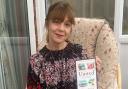 Dementia awareness campaigner and author Gina Awad with her book