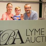 Simon and Susie Watson with their son Max at Lyme Bay Auctions. Ref edr 31 19TI 9214. Picture: Terry Ife