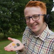 James Windsor with an Edward III gold half noble, a Roman umbornate broach and an Axminster volunteer button from the 1790s.