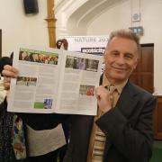 Chris Packham, posing with his feature in Little Green Change's student environmental magazine