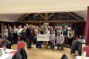 Honiton Young Farmers presenting cheques to their two chosen charities this year.