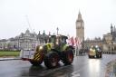 Farmers in tractors drive in Parliament Square ahead of a protest in central London over the changes to inheritance tax (IHT) rules.