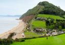 View across Branscombe Mouth and the thatched Sea Shanty beach café, looking west