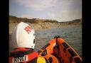 Lyme Regis RNLI deployed on Saturday (July 6) to search for two people cut off by the tide.