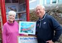 Liz from Coffee and Tots and Simon Wellington with one of his paintings.