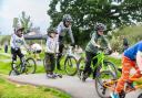 Children and teens testing the new pump track at Cranbrook.