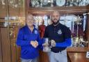 Captain Mark Parkinson sharing the trophy with vice Ryan Sellick