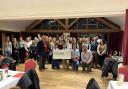 Honiton Young Farmers presenting cheques to their two chosen charities this year.