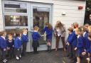 Staff and children officially open the new classroom