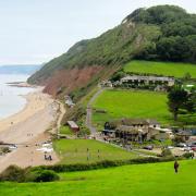 View across Branscombe Mouth and the thatched Sea Shanty beach café, looking west