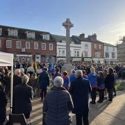 Honiton Remembrance Sunday parade in 2022. Crowds gather.