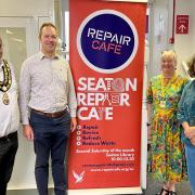 Cllr Amrik Singh, MP Richard Foord and members of Seaton Repair Café.