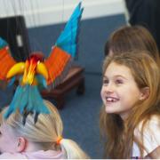 Puppets made from natural materials such as driftwood, roots, feathers, and leaves will put on a show