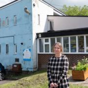 Claire Jones in front of the Honiton CUB building.