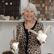 Artist Trisha Hayman with some of the objects she has painted