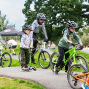 Children and teens testing the new pump track at Cranbrook.