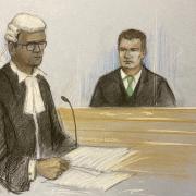 Court artist drawing by Elizabeth Cook of prosecution barrister Kannan Siva (left) with Pc Matthew Tregale, of Exeter, Devon, at Bristol Crown Court where he is charged with 12 offences relating to three women and sexual activity with a child. Picture