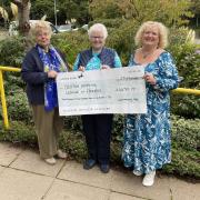 Yvonne Addington hands over to Carol Rowe, secretary for the league, and Mary Bowles, the new facilitator of the monthly memory café meetings