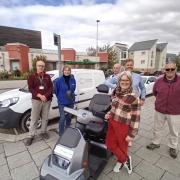 Cranbrook Town Council Councillors, Lesley Browne from LiveWest and Matt Rowett from Move More Cranbrook, celebrate the arrival of the mobility scooter