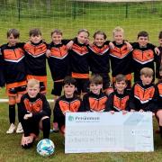 Broadclyst FC receives the cheque