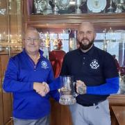 Captain Mark Parkinson sharing the trophy with vice Ryan Sellick