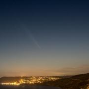 Photo of Comet A3 (Tsuchinshan-Atlas) passing over Lyme Regis on Thursday, October 17.