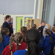 The was welcomed by the school's choir