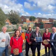 Friends of Feniton Station receives a plaque for Biodiversity as part of the South Western Railway Community Rail Awards