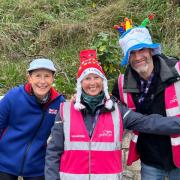 Marilyn Hughes (centre) receives a prize from Event Directors, Carol Austin and Tony Smith for volunteering the most times over the eight years of Seaton parkrun