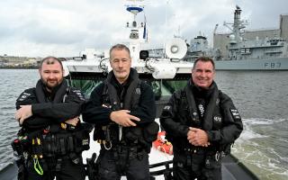 Three Devon police officers who boarded a boat in dangerous conditions to restrain a man who was threatening to set himself alight have won Defence Police Federation Bravery Awards.