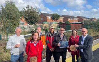 Friends of Feniton Station receives a plaque for Biodiversity as part of the South Western Railway Community Rail Awards